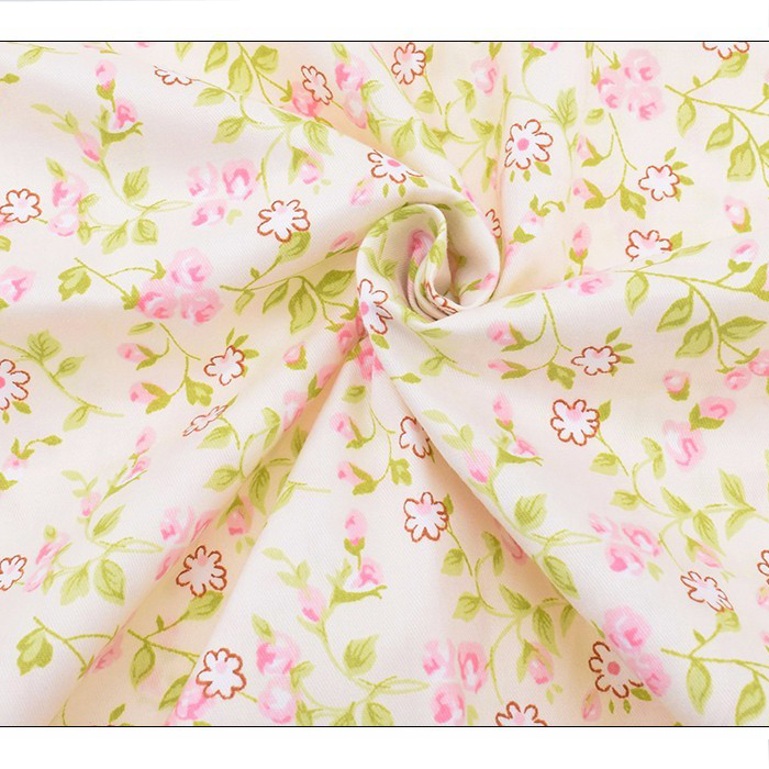 Ткань с нежными розово-салатовыми цветами на молочном фоне 