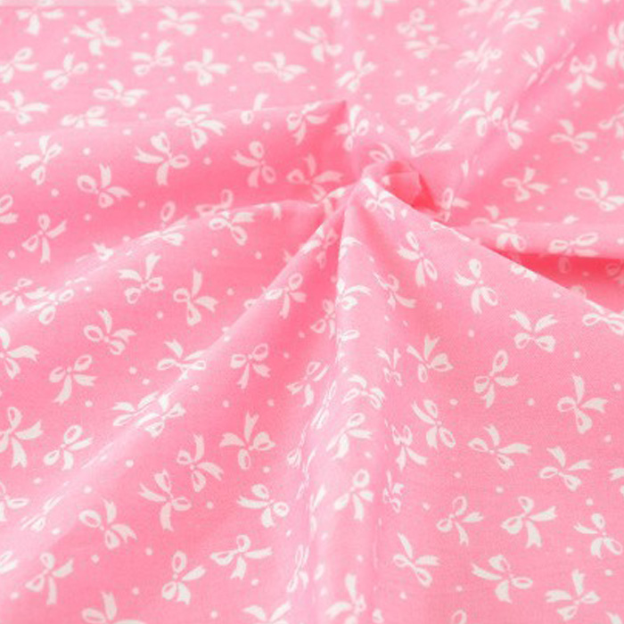 Ткань "Мелкие белые бантики на розовом фоне"   